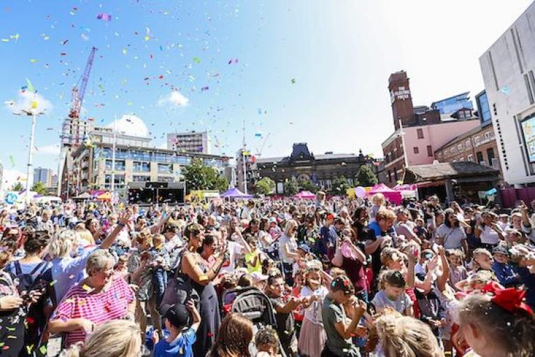 A large crowd of people celebrating