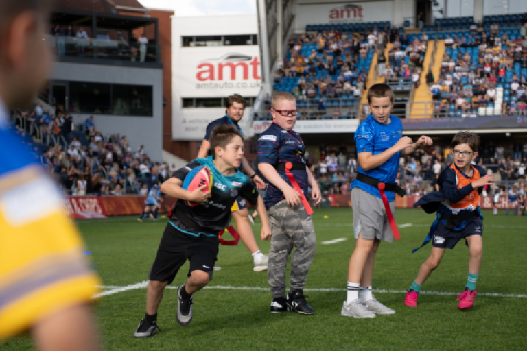 Children playing Sensory Tag Rugby at Headingley Stadium